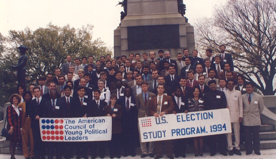 Group shot with participants from the 1994 Election Study Program posting in DC in front of a statue.